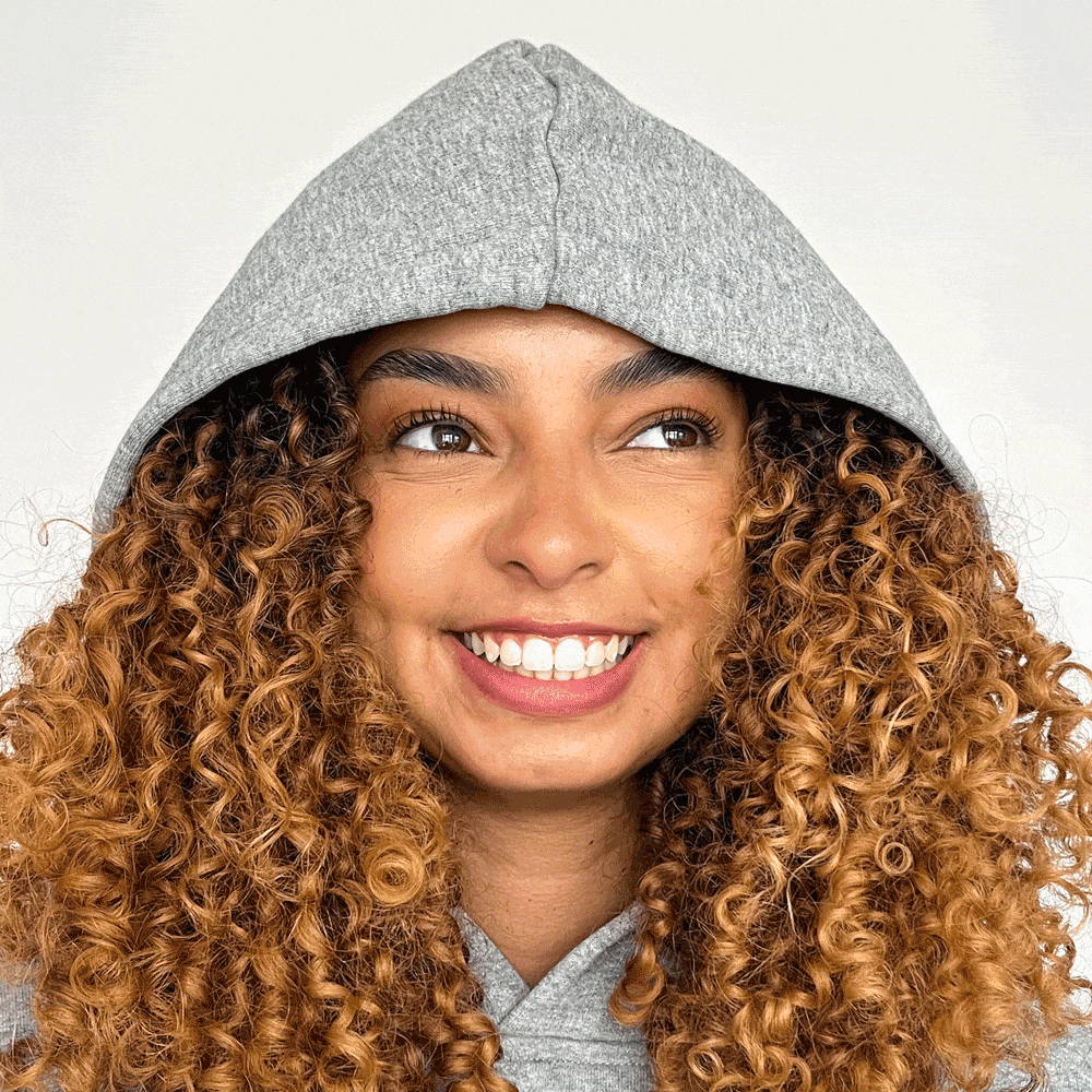 Model wearing grey silk lined hoodie showing inner hoodie lining