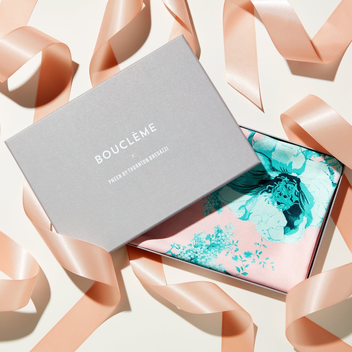 Introducing the Bouclème scarf, designed with British brand Preen using one of their iconic prints in signature Bouclème pastels using 100% recycled polyester. Vegan friendly.