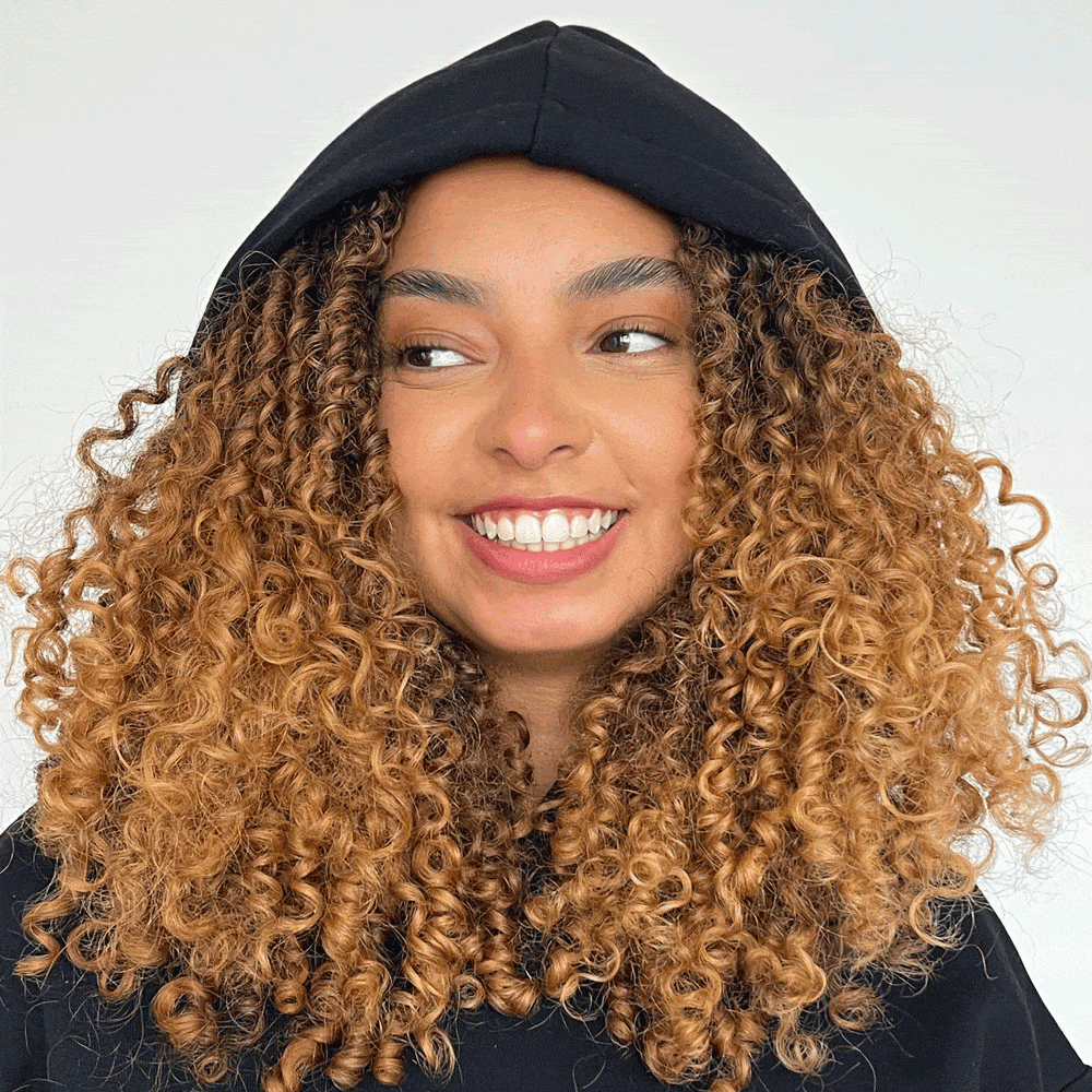 Model wearing black silk lined hoodie showing inner hoodie lining