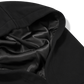 Close-up of a black silk fabric with folds on a transparent background