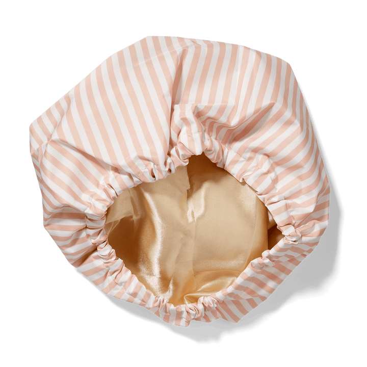 Bouclème pink and white striped satin lined shower cap on a transparent background