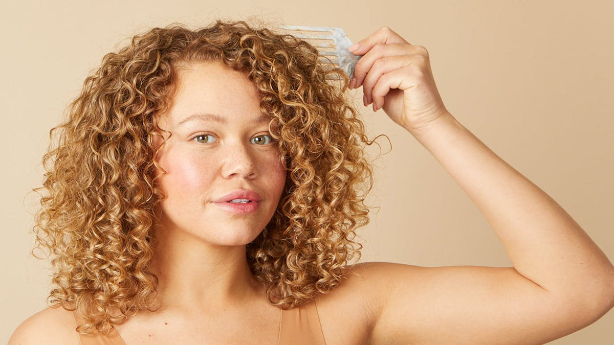 A nutrient rich, lightweight oil by Boucleme that conditions and protects hair against humidity | Bouclème | Curls Redefined