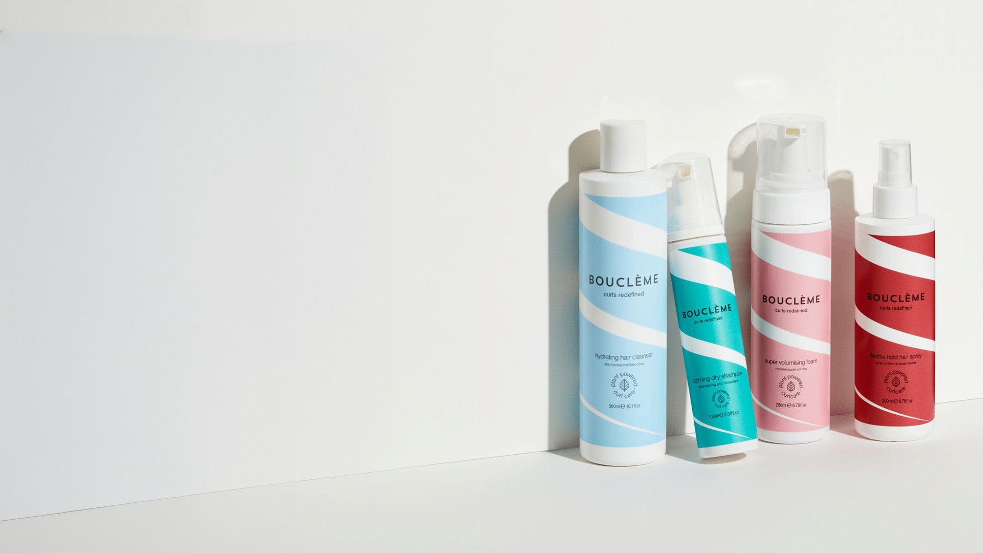 A collection of Bouclème Volume Range products, beautifully arranged against a clean background.