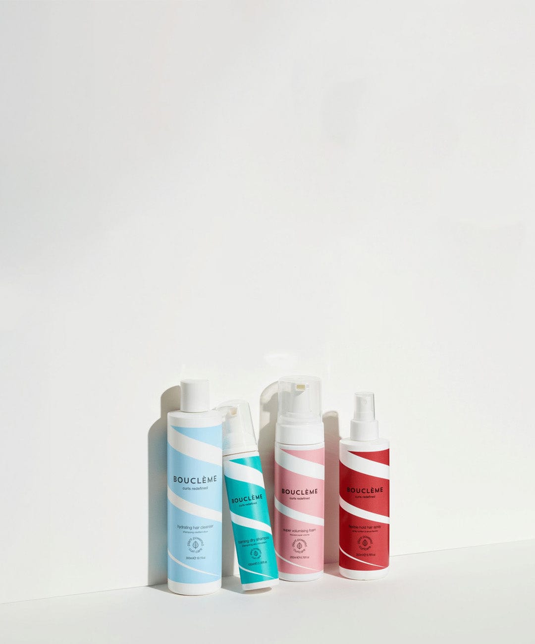 A collection of Bouclème Volume Range products, beautifully arranged against a clean background.